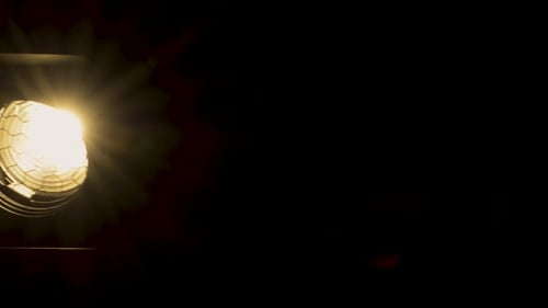 Bright Spotlight Shines in Dark Studio