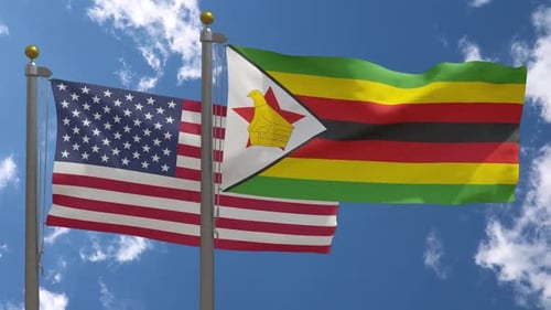 USA And Zimbabwe Flags Waving In Blue Sky