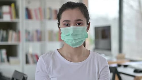 Portrait of Careful Young Asian Woman with Face Mask
