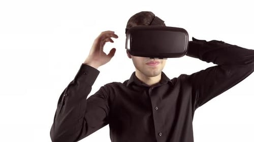 Young Man Adjusting Virtual Reality Headset