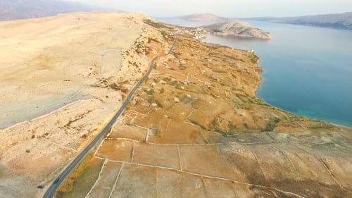 Aerial view of road through barren landscape of Pag island in Croatia