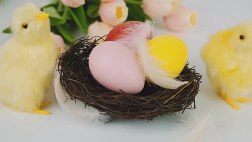 Festive Easter Nest with Colorful Eggs and Chicks