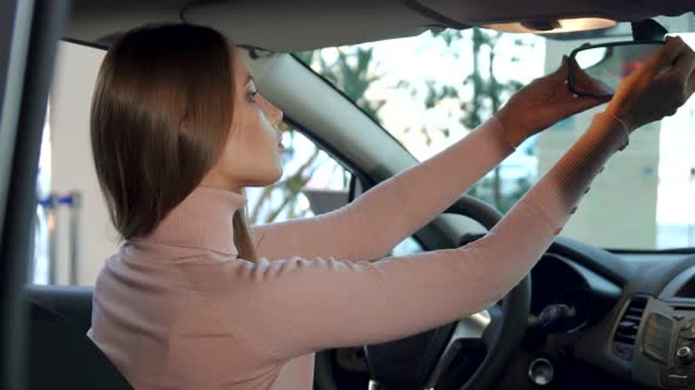 Girl Adjusts Rear-view Mirror Inside the Car, People Stock Footage ft ...