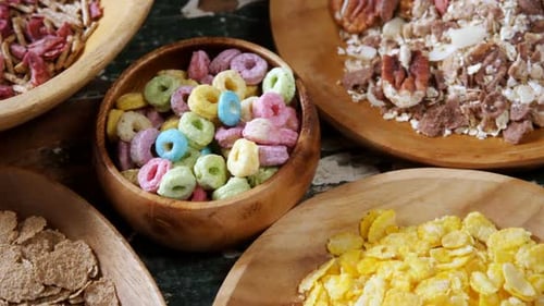Variety of Colorful Breakfast Cereal in Wooden Bowls