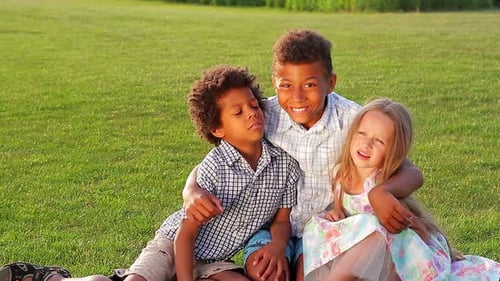 Kids Hugging on Sunny Day in Park