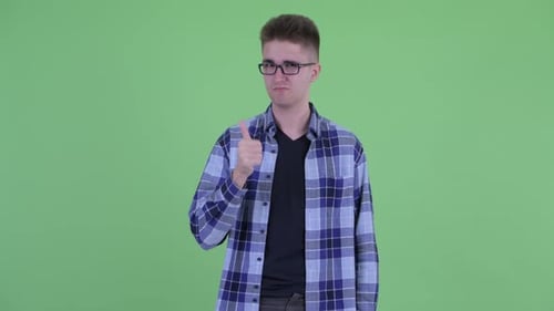 Young Adult Man Giving OK Hand Gesture