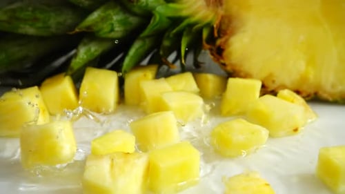 Pineapple Cubes Falling and Splashing