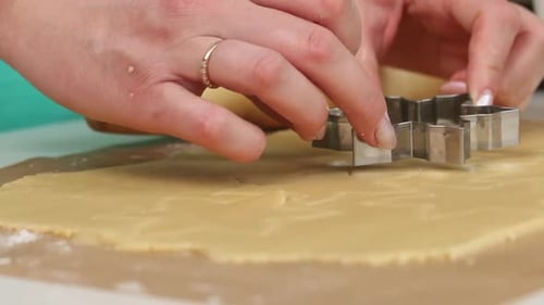 Preparing Christmas Cookies with Star Shaped Cutter