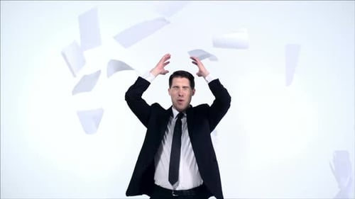 Stressed Man Throwing Paper in Frustration