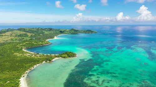 A Tropical Island with a Turquoise Lagoon and a Sandbank