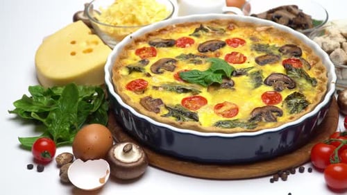 Baked Homemade Quiche Pie in Ceramic Baking Form Eggs and Cream