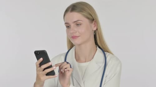 Young Doctor Uses Smartphone in Clinic