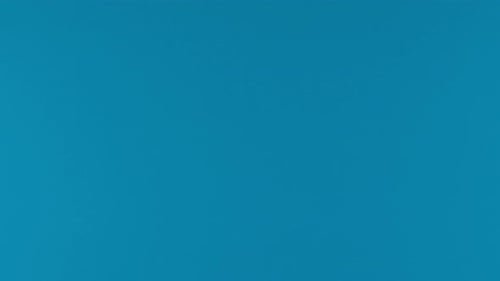 Yellow Bell Pepper Floating on Blue Background