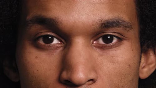 Close up portrait of the African man. Shot with RED helium camera in 8K.