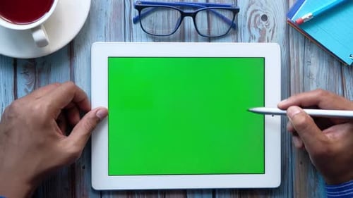 Top View of Businessman Using Digital Tablet on Office Desk