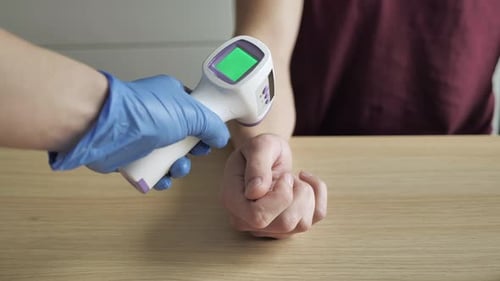 Measuring Temperature with Infrared Contactless Thermometer at Epidemic Covid19