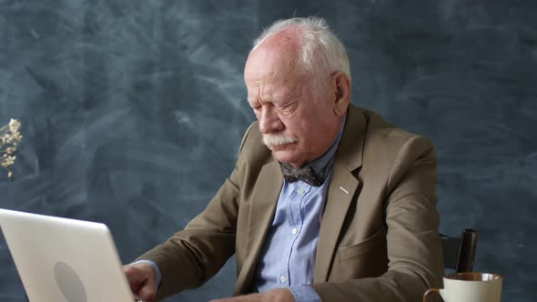 Senior Man Typing on Laptop at Desk, People Stock Footage ft. senior ...