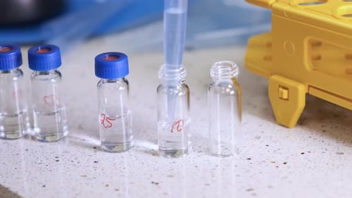 Pipette Extracting Liquid into Glass Vial