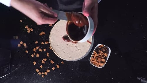 Pouring Chocolate on Cake from Birds Eye View