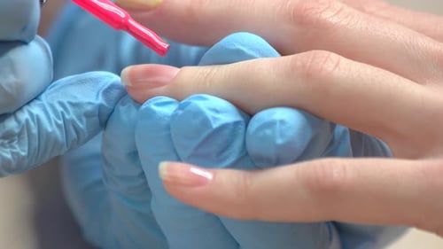 Applying of Pink Polish Close Up
