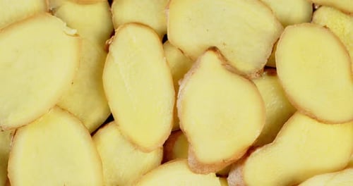 Slices of Fresh Ginger Slowly Rotate.