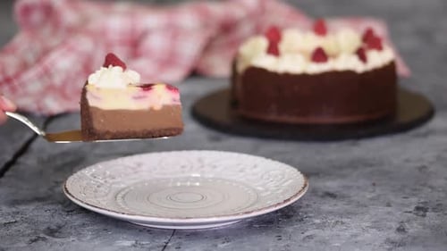 Piece of Chocolate Raspberry Cheesecake with Whipping Cream
