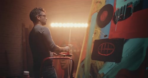 Artist Paints Bold Abstract Artwork in His Studio