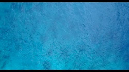 Aerial travel of idyllic coastline beach vacation by turquoise ocean with white sandy background of