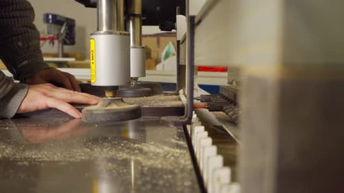 Worker Using Woodworking Machine in Workplace
