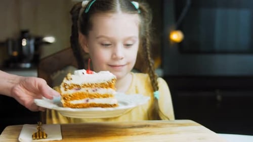 Young Girl Gets a Delicious Piece of Cake