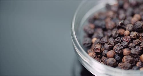 Close up of Black Peppercorns in Glass Bowl