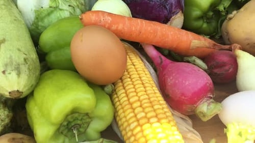 Fresh Vegetables Including Corn, Peppers, Zucchini, Potatoes