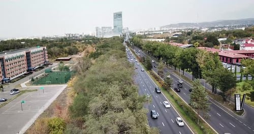 Flight Over the City of Almaty in the Smog.