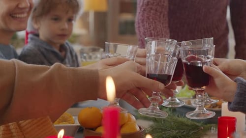Family Toasting Wine at Holiday Dinner Table