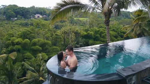 Couple Kissing in the Pool Right in the Jungle in Bali