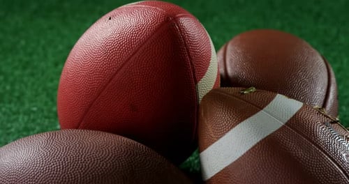 American footballs on artificial turf