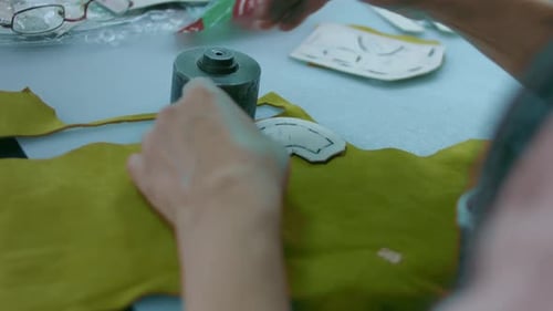 Sewing Machine in a Leather Workshop in Action with Hands Working on a Leather Details for Shoes