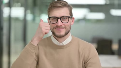 Young Adult Giving Thumbs Up