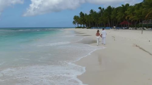 Tropical Beach Two People are Walking Happy Couple in Love Aerial Footage
