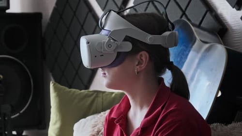Woman Wearing Virtual Reality Headset Indoors