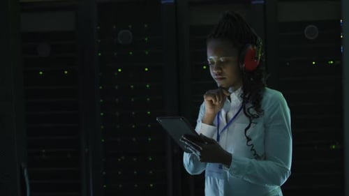 Woman Uses Tablet in Server Room