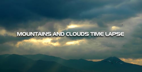 Stormy Clouds and Sun Rays over Mountain Range