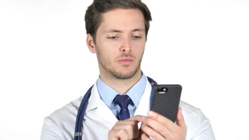 Young Adult Doctor Using Phone in White Studio