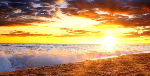 Peaceful Ocean Waves on Sandy Beach at Sunset