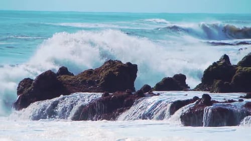 Wall of Water and Turbulent Waves of Pacific Ocean and Rugged Beauty of Basalt Rocks Reef and Cay