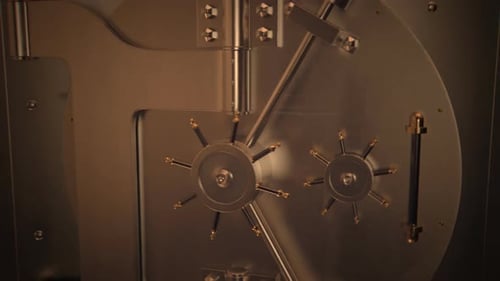 A solid metal gate used by bank to protect and secure all of the stored deposit.