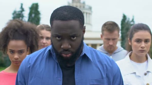 Group of Young Adults Staring Seriously Ahead