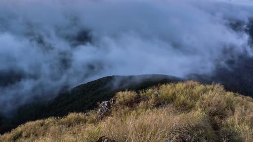 Foggy Clouds Moving over Mountains Ridge in New Zealand Nature