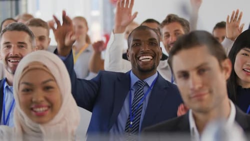 Diverse Group Waving Hands at Business Meeting