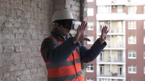 Construction Worker Using VR Goggles at Building Site